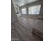 Inviting living room features sleek laminate flooring and natural light at 4065 E University Dr # 242, Mesa, AZ 85205