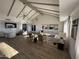 Spacious lounge features vaulted ceilings, modern lighting, and comfortable seating arrangements, creating a welcoming atmosphere at 4065 E University Dr # 242, Mesa, AZ 85205
