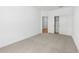 Bedroom with a closet, neutral color scheme, carpet flooring, and natural light at 42460 W Peters Dr, Maricopa, AZ 85138