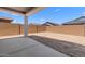 Covered patio area overlooking a spacious backyard, perfect for outdoor living at 42460 W Peters Dr, Maricopa, AZ 85138