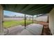 Spacious backyard features a covered patio and lush lawn, perfect for outdoor entertaining at 4530 W Larkspur Dr, Glendale, AZ 85304