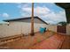 Brick-lined backyard featuring low maintenance landscaping, block fence, and mature palm trees at 4530 W Larkspur Dr, Glendale, AZ 85304