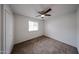 Bedroom featuring neutral paint, plush carpeting, a ceiling fan and window at 4530 W Larkspur Dr, Glendale, AZ 85304