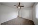 Bedroom featuring neutral paint, plush carpeting, a ceiling fan and closet at 4530 W Larkspur Dr, Glendale, AZ 85304