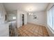 Open dining room showcasing tile flooring, bar seating, and a decorative mirror at 4530 W Larkspur Dr, Glendale, AZ 85304