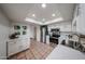 Bright kitchen with stainless steel appliances and white cabinetry, creating a modern and airy space at 4530 W Larkspur Dr, Glendale, AZ 85304