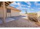 Backyard featuring low maintenance landscaping, including stone and desert bushes at 4538 E Shomi St, Phoenix, AZ 85044