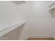 White closet with built-in shelving and light wood floors at 4538 E Shomi St, Phoenix, AZ 85044