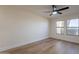 Empty room with a ceiling fan, neutral walls, and a large windows at 4538 E Shomi St, Phoenix, AZ 85044