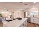 Spacious kitchen with white countertops and cabinets, an island with seating, and an open layout at 4538 E Shomi St, Phoenix, AZ 85044