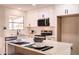 Well-lit kitchen with quartz countertops, stainless steel appliances, and white cabinetry at 4538 E Shomi St, Phoenix, AZ 85044
