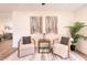 Inviting living area with stylish chairs, decorative art, neutral rug and wood flooring at 4538 E Shomi St, Phoenix, AZ 85044