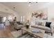 Bright living room with neutral gray decor and an open floorplan at 4538 E Shomi St, Phoenix, AZ 85044