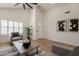 Living room with vaulted ceiling, neutral gray decor, and plantation shutters at 4538 E Shomi St, Phoenix, AZ 85044
