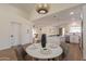 Open concept living space featuring a dining area, kitchen, and breakfast bar at 4538 E Shomi St, Phoenix, AZ 85044