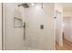 Walk-in shower features white tile, black hardware, and a decorative shower niche at 4538 E Shomi St, Phoenix, AZ 85044