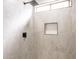 Updated shower stall featuring a modern shower head and tiled walls at 4538 E Shomi St, Phoenix, AZ 85044