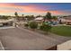 Aerial view of the landscaped grounds with the pool, carport, and surrounding neighborhood at 5044 W Electra Ln, Glendale, AZ 85310
