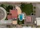 Aerial view of a home showcasing the backyard, pool, landscaping and the surrounding neighborhood at 5044 W Electra Ln, Glendale, AZ 85310