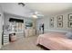 Cozy bedroom with a ceiling fan, light colored walls, and decor at 5044 W Electra Ln, Glendale, AZ 85310