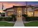 Charming home entrance with brick accents and decorative front door at 5044 W Electra Ln, Glendale, AZ 85310