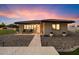 Charming front exterior with a welcoming entrance, well-maintained landscaping, and a cozy seating area at 5044 W Electra Ln, Glendale, AZ 85310