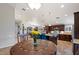 Open-concept kitchen and dining area, with tile floors and seamless flow at 5044 W Electra Ln, Glendale, AZ 85310