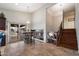 Kitchen and entry with staircase with granite countertops and stainless steel appliances at 5044 W Electra Ln, Glendale, AZ 85310