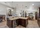 Spacious kitchen island boasts a beverage fridge and granite countertops at 5044 W Electra Ln, Glendale, AZ 85310