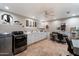 Spacious laundry room offering lots of counterspace, white cabinets, and modern washer and dryer units at 5044 W Electra Ln, Glendale, AZ 85310