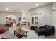 Bright, open-concept living room with neutral tones and stylish decor at 5044 W Electra Ln, Glendale, AZ 85310