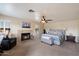 Spacious main bedroom with fireplace and ample space for a bedroom set and seating at 5044 W Electra Ln, Glendale, AZ 85310