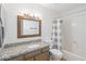 Bathroom boasts granite counters, ample lighting, and a shower-tub combination at 540 N May -- # 2110, Mesa, AZ 85201