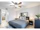 Comfortable bedroom showcasing wood flooring, a ceiling fan, and a decorative mirror at 540 N May -- # 2110, Mesa, AZ 85201