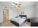 Bright bedroom featuring neutral walls, modern ceiling fan, and a view to an organized closet at 540 N May -- # 2110, Mesa, AZ 85201