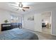 Spacious bedroom featuring wood-look flooring, a ceiling fan, and natural light at 540 N May -- # 2110, Mesa, AZ 85201