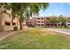 Condominium building with a meticulously maintained lawn and mature shade trees at 540 N May -- # 2110, Mesa, AZ 85201