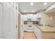 Bright kitchen featuring granite countertops, white cabinetry, and an adjacent dining area at 540 N May -- # 2110, Mesa, AZ 85201