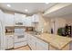 Kitchen with granite countertops, recessed lighting, and white appliances at 540 N May -- # 2110, Mesa, AZ 85201