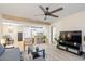 Inviting living room features a ceiling fan, neutral paint, and an adjacent eat-in kitchen at 540 N May -- # 2110, Mesa, AZ 85201