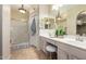 Well-lit bathroom with double vanity sinks and a glass-enclosed shower at 5445 E Mckellips Rd # 48, Mesa, AZ 85215