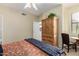 Bedroom with light walls, ceiling fan, blue bed cover, and wooden furniture at 5445 E Mckellips Rd # 48, Mesa, AZ 85215