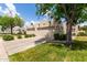 Attractive single-story home featuring a two-car garage, desert landscaping, and a well-maintained lawn at 5445 E Mckellips Rd # 48, Mesa, AZ 85215