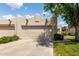 Lovely home with a two-car garage, xeriscaping, and a well-manicured lawn at 5445 E Mckellips Rd # 48, Mesa, AZ 85215