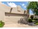 Charming home featuring a two-car garage, desert landscaping, and shade tree at 5445 E Mckellips Rd # 48, Mesa, AZ 85215
