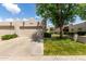 Charming single-story home with a two-car garage and desert landscaping at 5445 E Mckellips Rd # 48, Mesa, AZ 85215