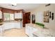Open kitchen boasting a stylish island, ample counter space, and tile flooring at 5445 E Mckellips Rd # 48, Mesa, AZ 85215