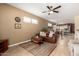 Open-concept living room with a ceiling fan and views of the dining area and kitchen at 5445 E Mckellips Rd # 48, Mesa, AZ 85215