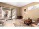 Comfortable living room with sliding glass doors leading to a landscaped patio at 5445 E Mckellips Rd # 48, Mesa, AZ 85215