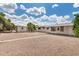 A spacious backyard with a patio cover, storage shed, and plenty of space for activities at 5818 E Colby St, Mesa, AZ 85205